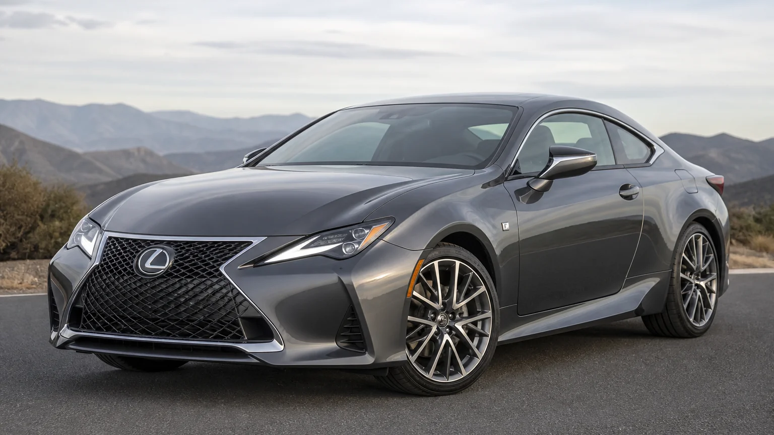 A Lexus RC luxury coupe, three-quarter front view, parked on a quiet street.