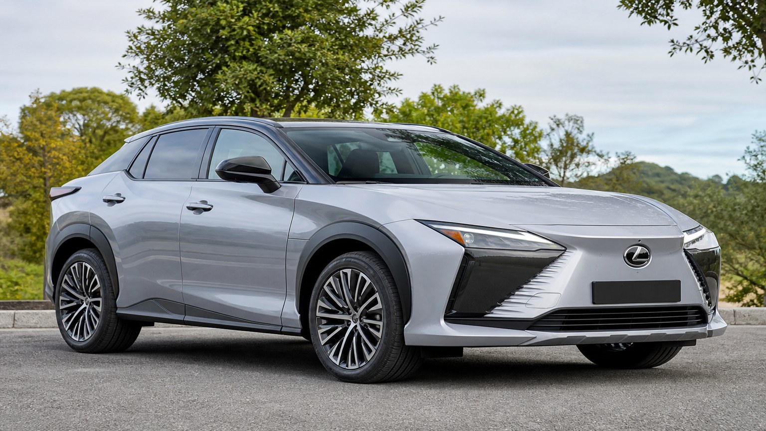 A cleaner later-model Lexus RZ on a quiet road.