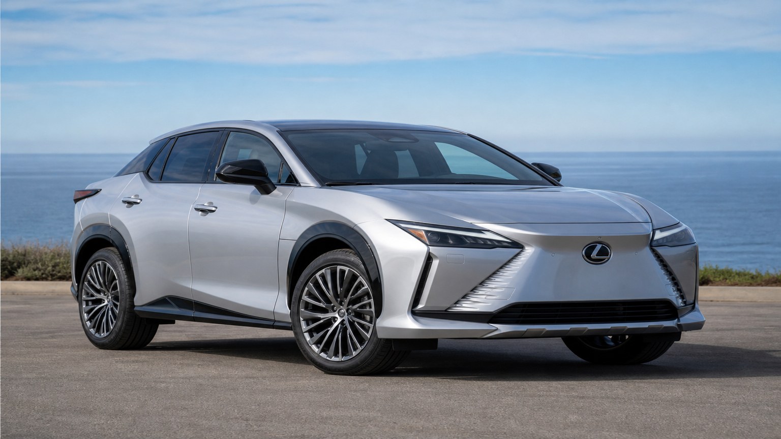 A Lexus RZ parked outdoors, three-quarter front view.