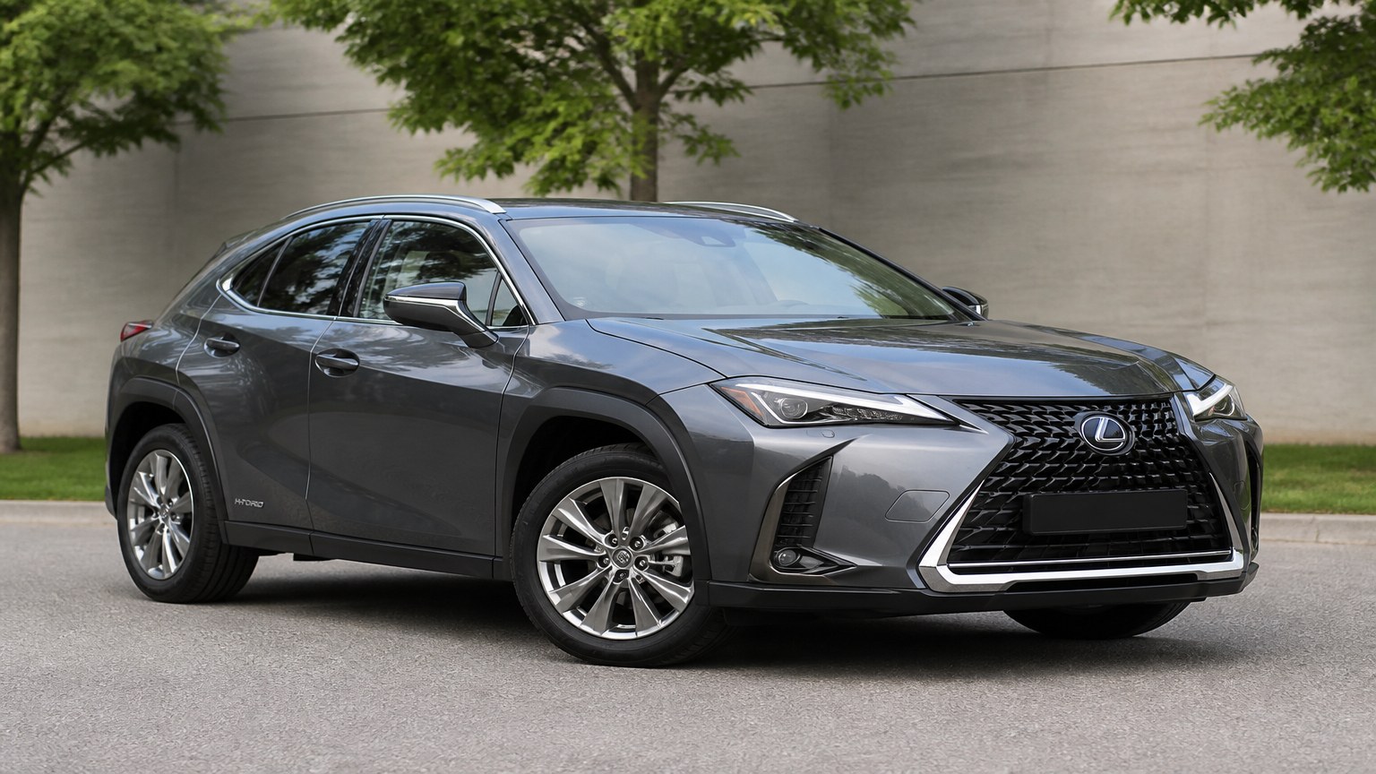 A cleaner later-model Lexus UX on a quiet road.