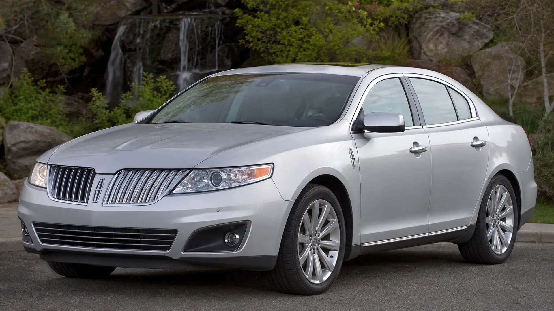 A Lincoln MKS parked outdoors.