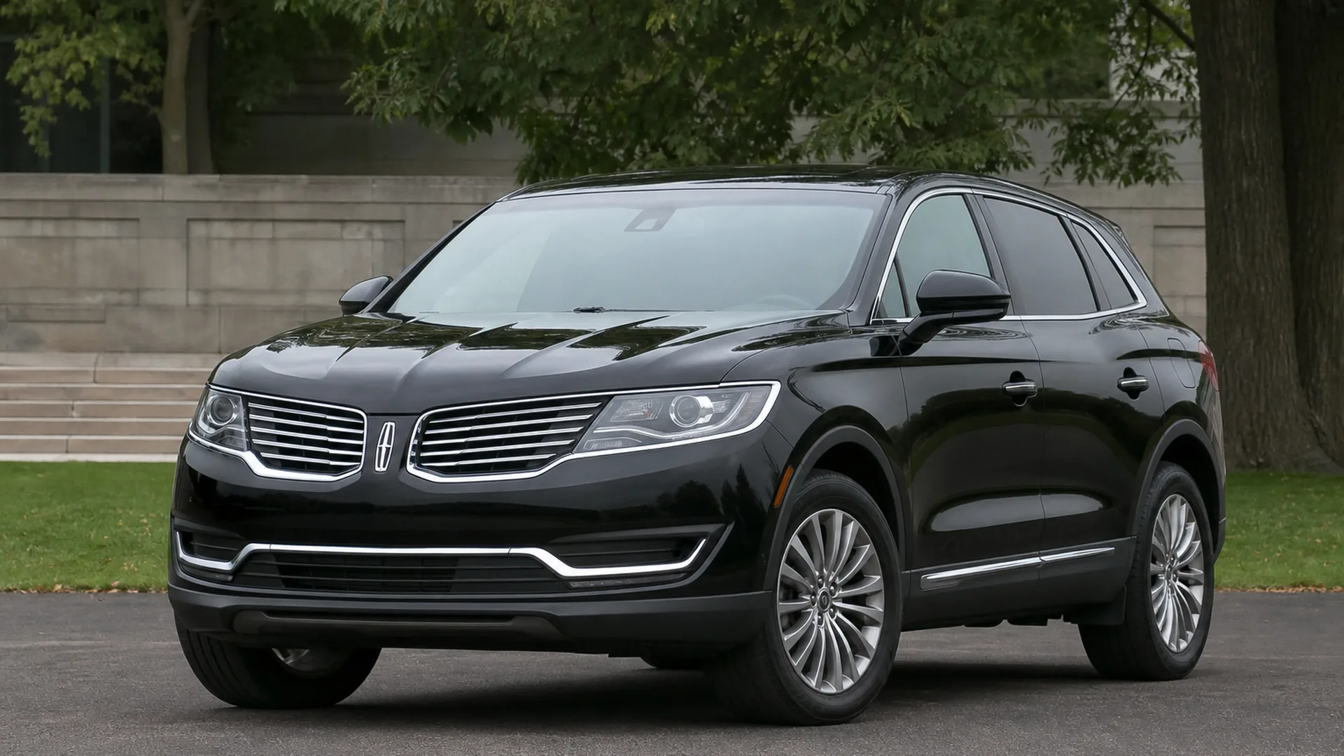 A black Lincoln MKX crossover parked outdoors.