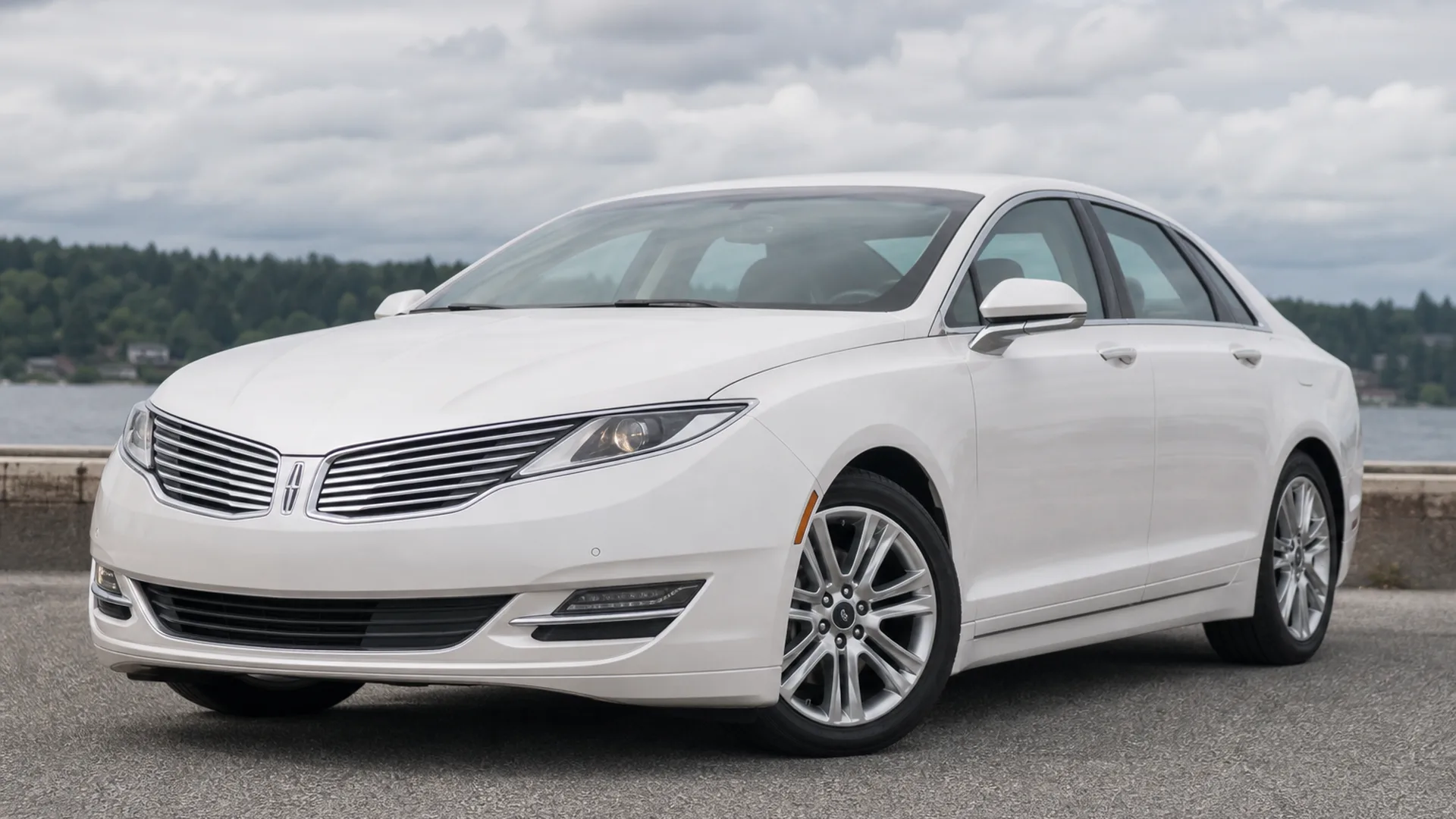 A white Lincoln MKZ sedan parked outdoors.