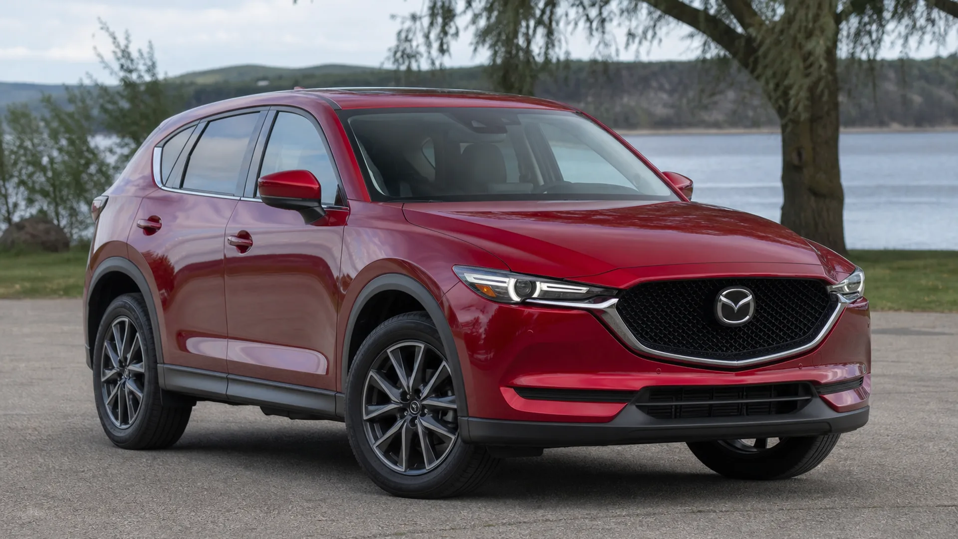 A red Mazda CX-5 crossover parked outdoors.