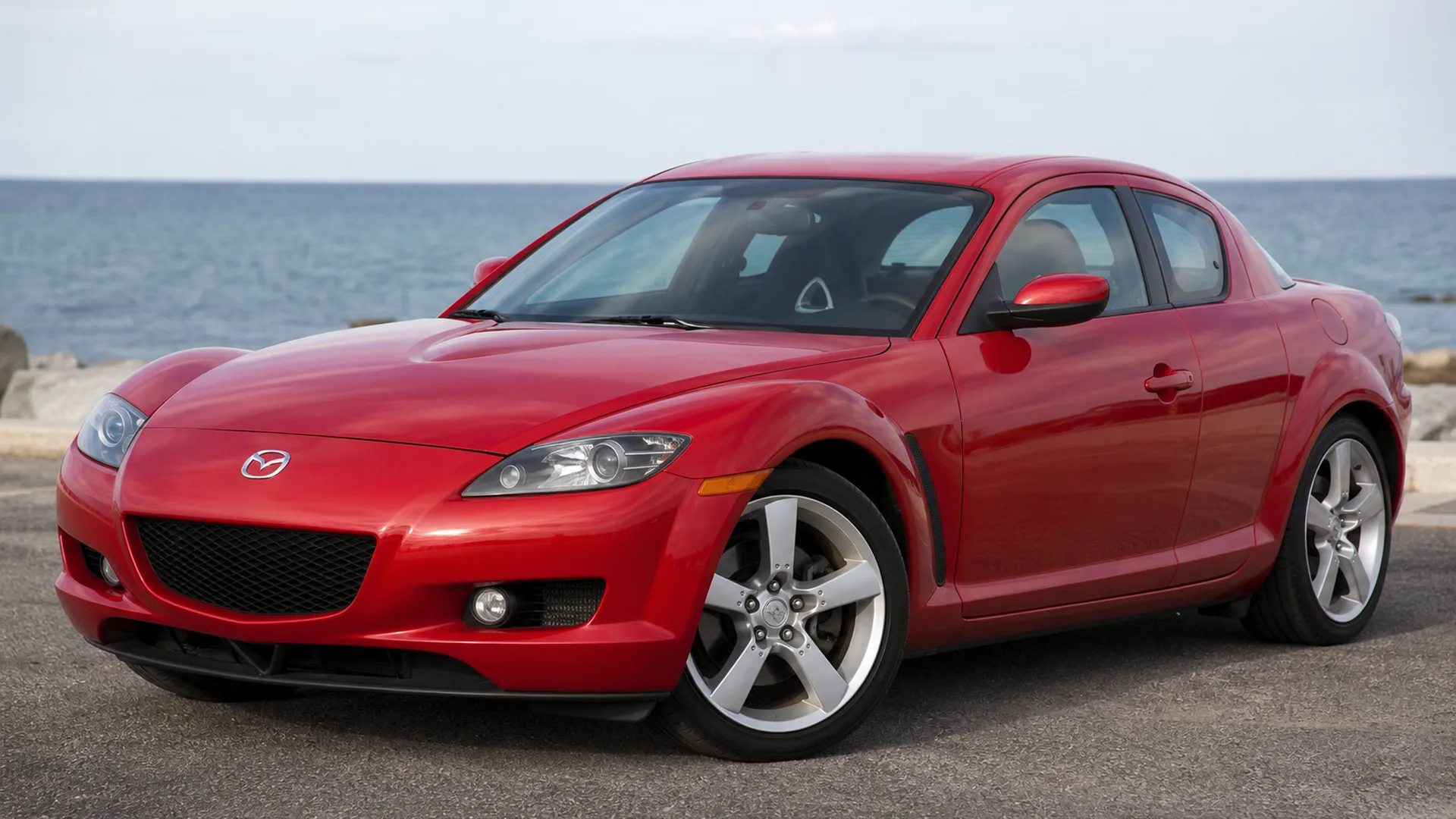 A Mazda RX 8 parked outdoors.