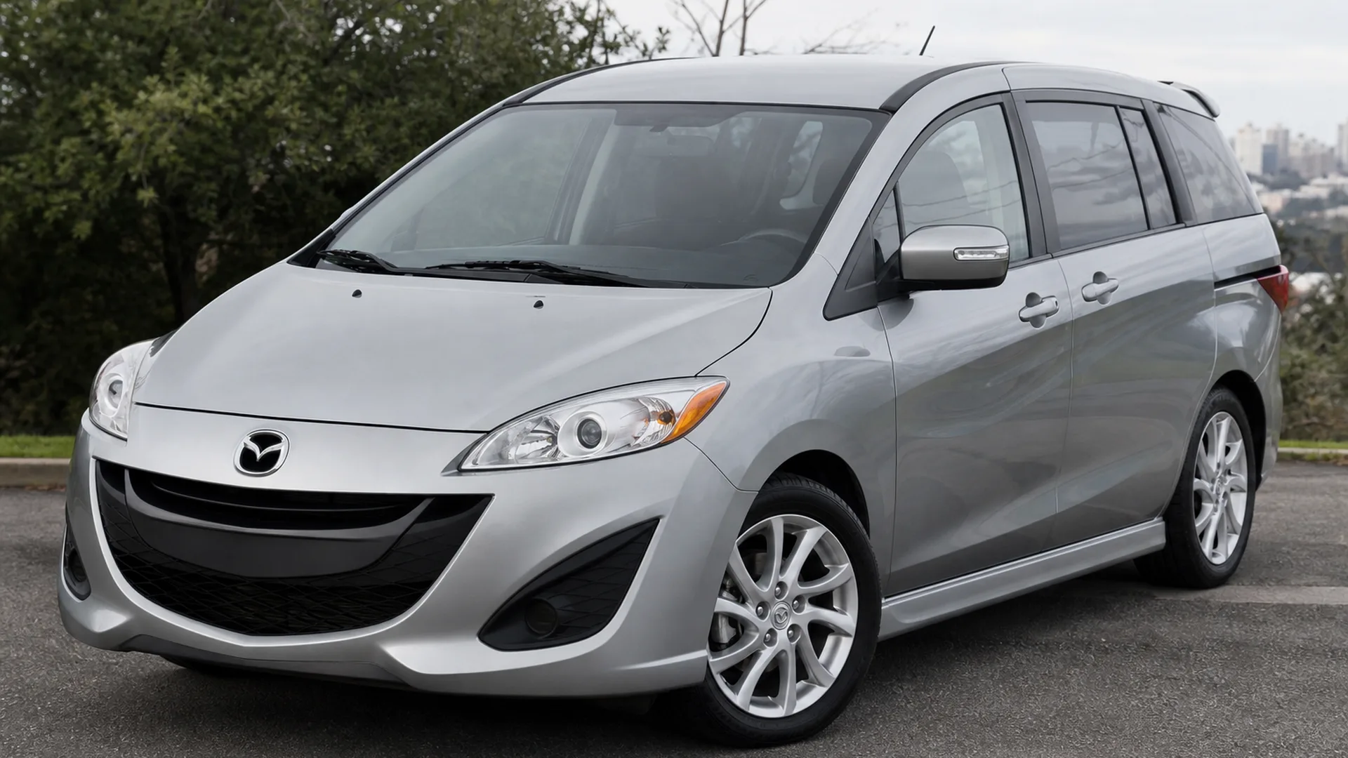 A Mazda 5 parked outdoors.
