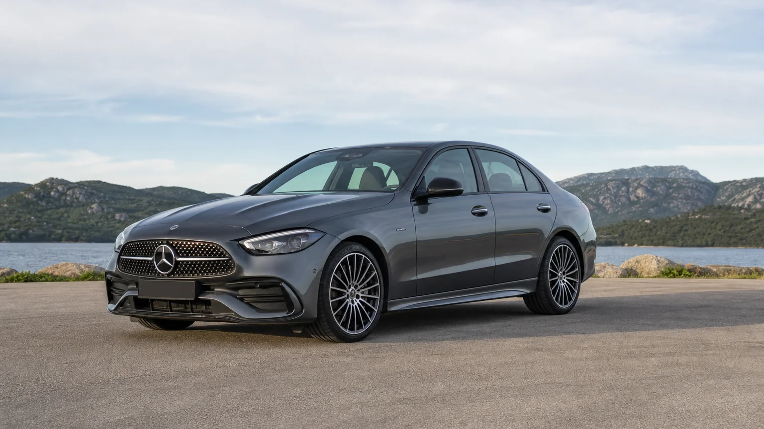 A Mercedes-Benz C-Class sedan, three-quarter front view, parked on a quiet street.