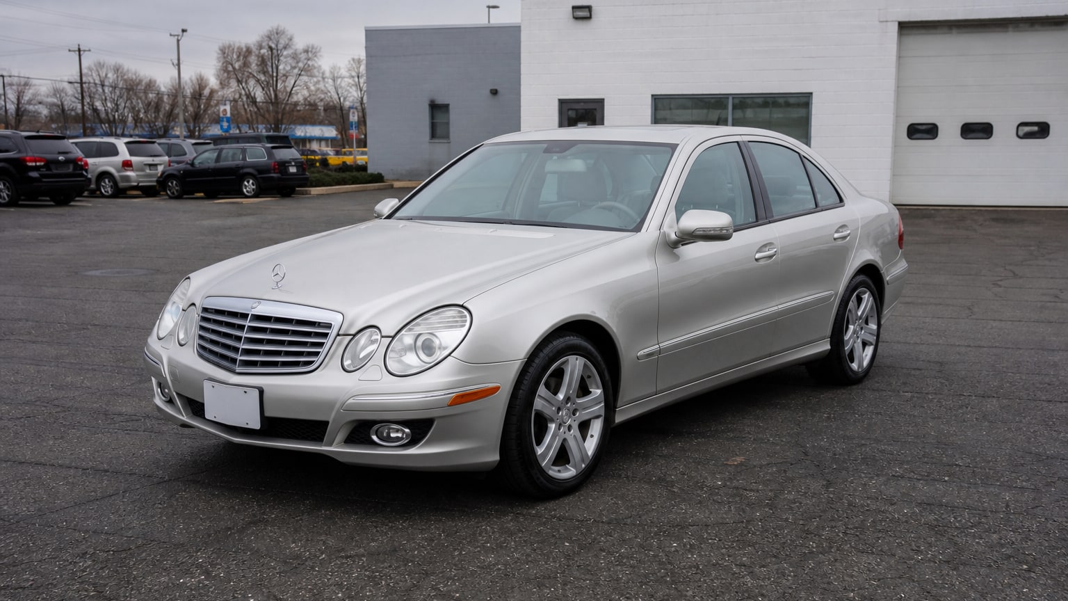 A higher-risk Mercedes-Benz E-Class model year parked in a dealership lot.