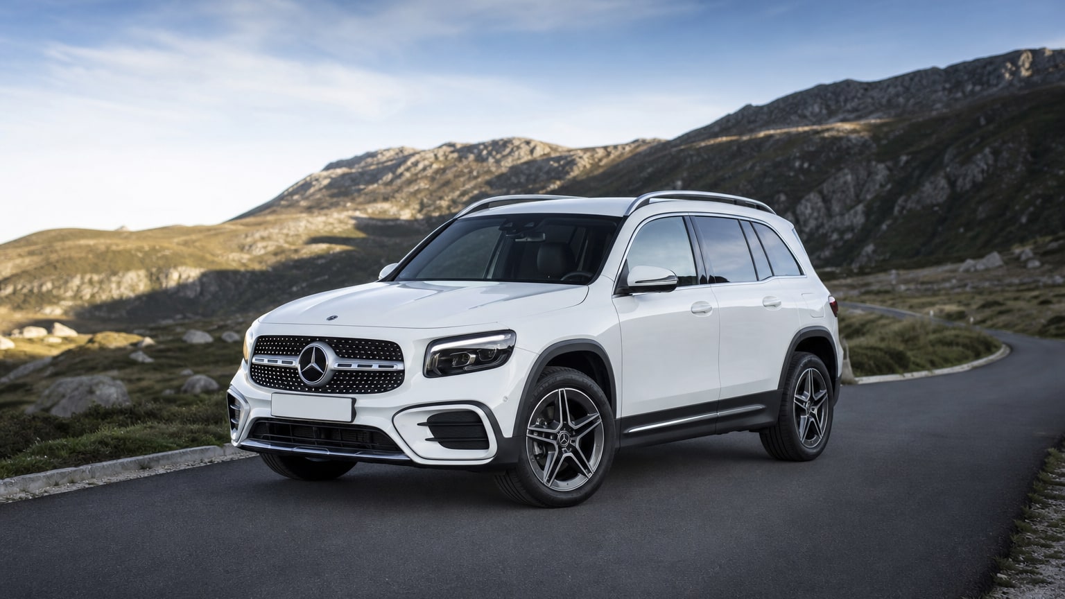 A cleaner later-model Mercedes-Benz GLB on a quiet road.