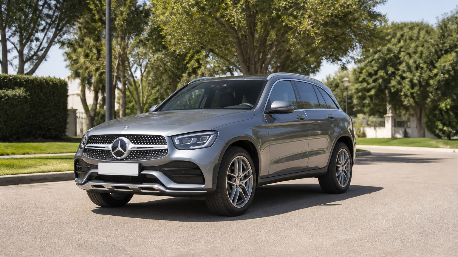 A cleaner later-model Mercedes-Benz GLC on a quiet road.