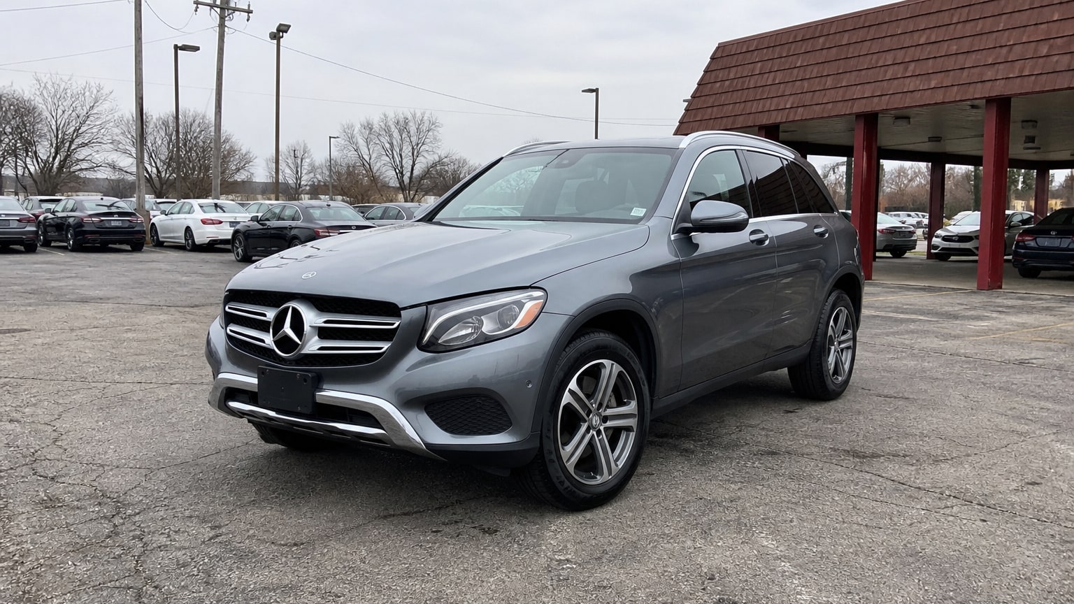 A higher-risk Mercedes-Benz GLC model year parked in a dealership lot.