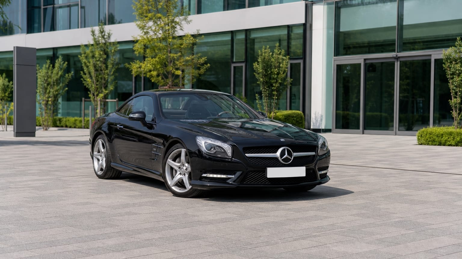A Mercedes-Benz SL parked outdoors, three-quarter front view.