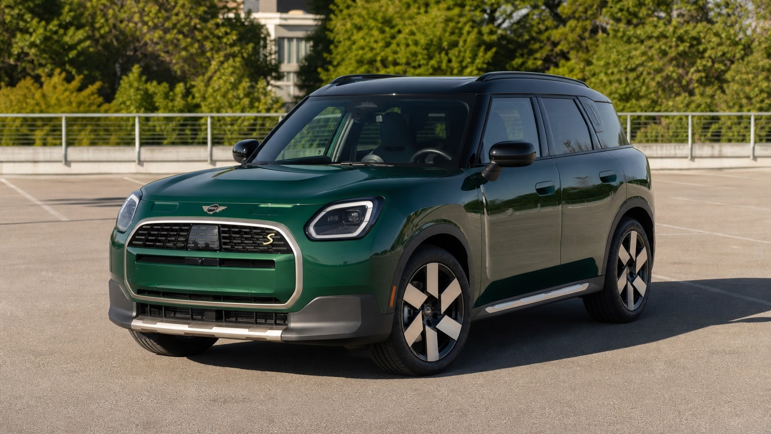 A cleaner later-model Mini Countryman on a quiet road.