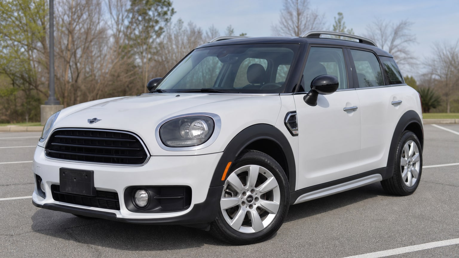 A higher-risk Mini Countryman model year parked in a dealership lot.