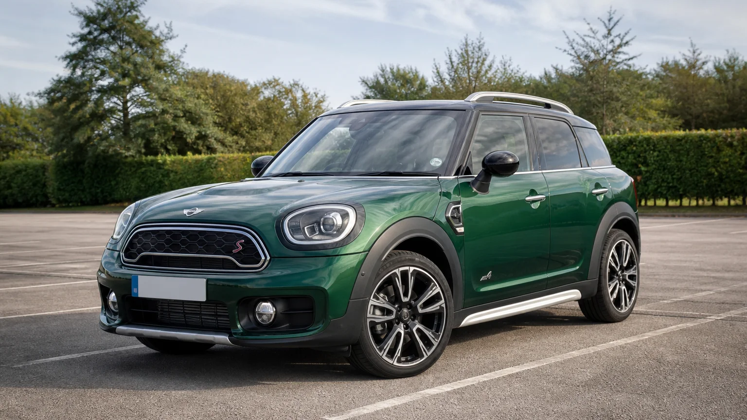 A Mini Countryman, three-quarter front view, parked outdoors.