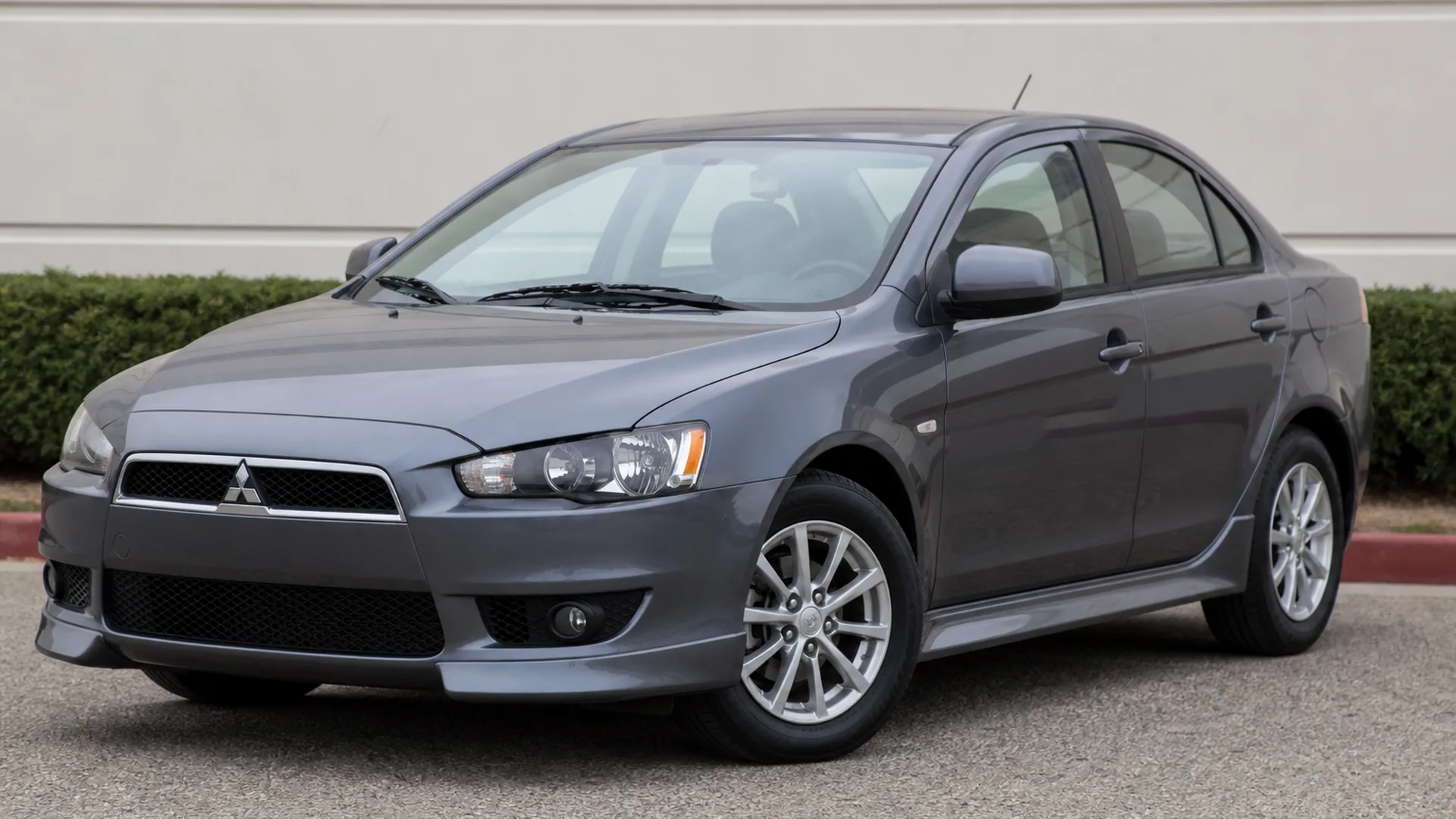 A Mitsubishi Lancer parked outdoors.