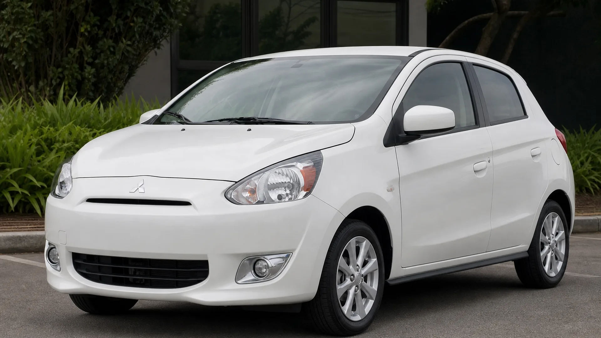 A Mitsubishi Mirage parked outdoors.