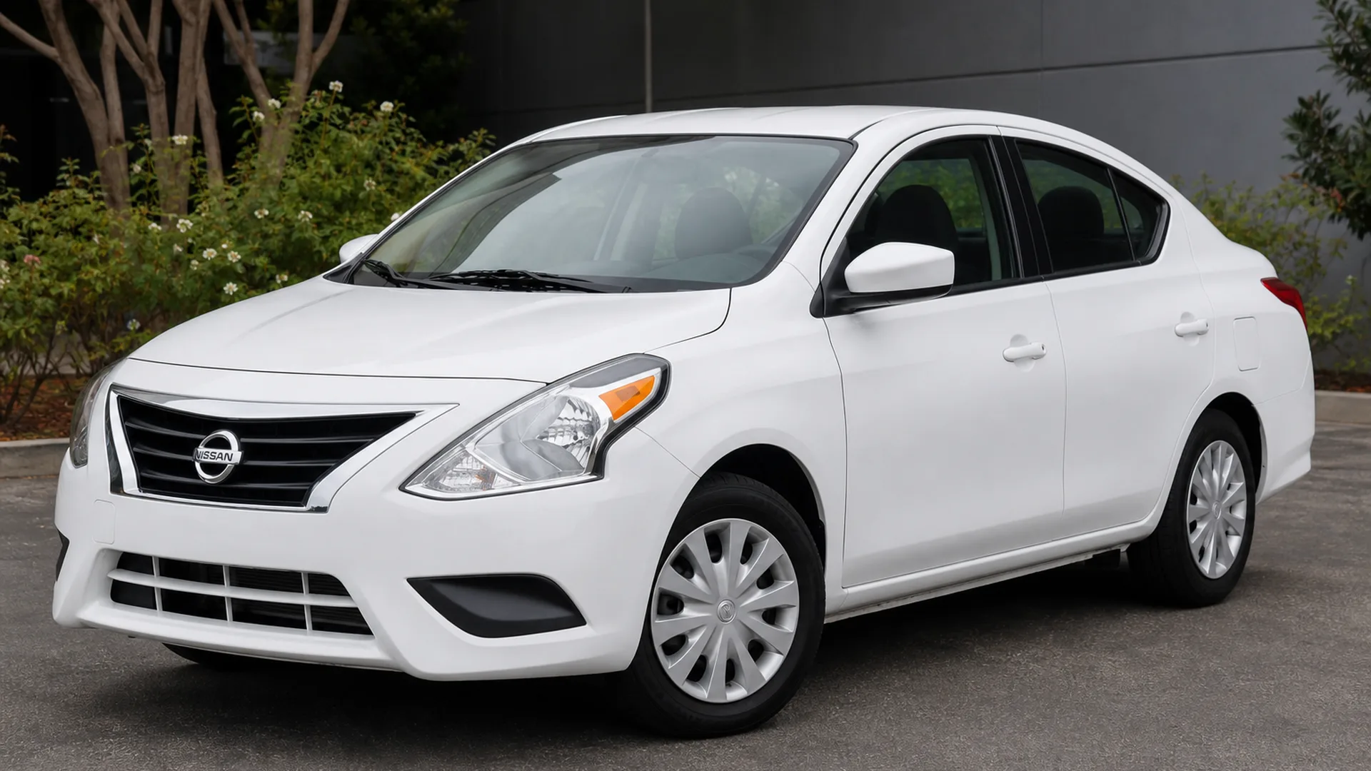 A Nissan Versa parked outdoors.