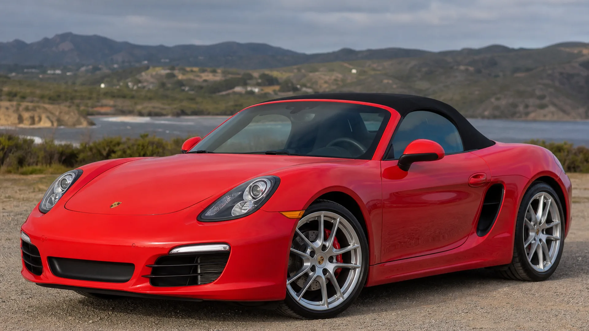 A Porsche Boxster parked outdoors.