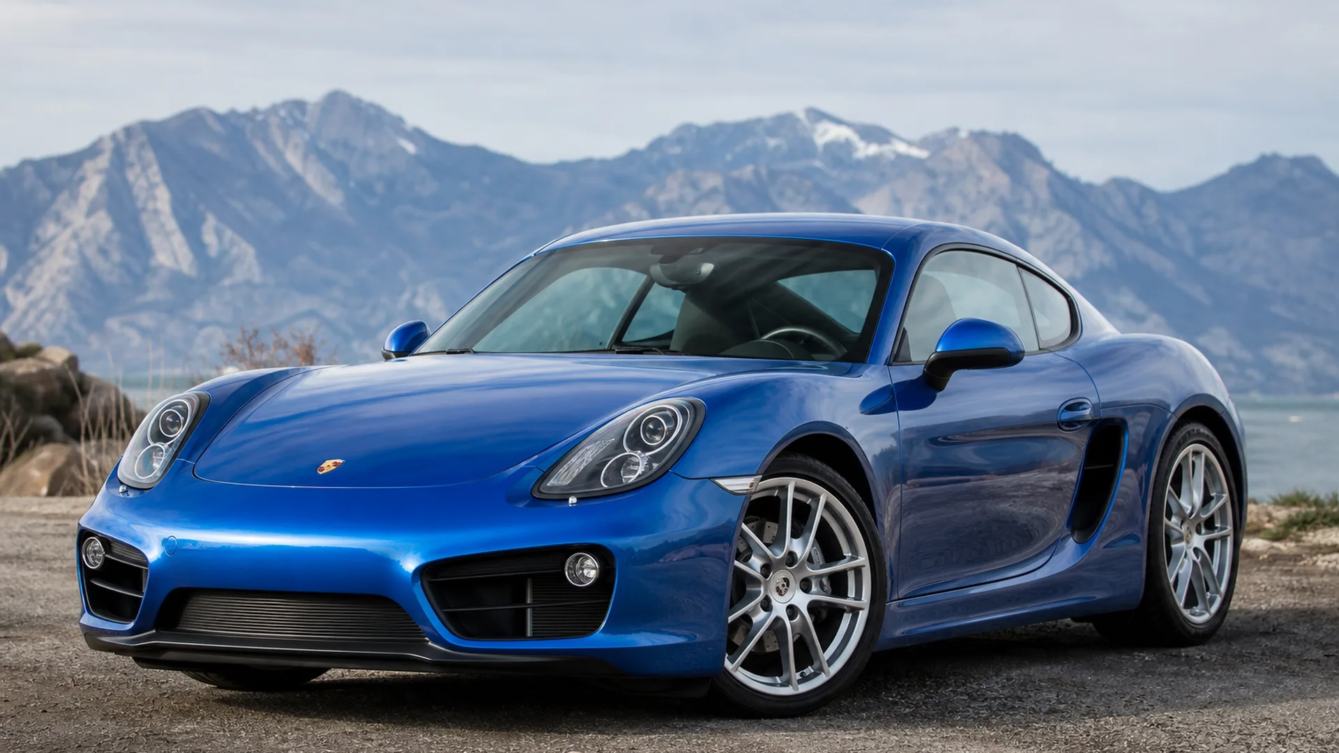 A Porsche Cayman parked outdoors.