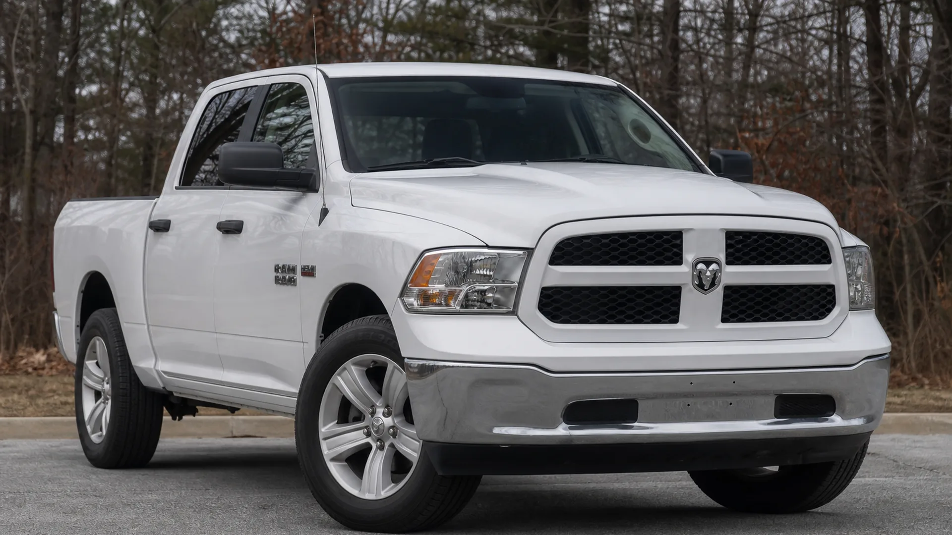 A white Ram 1500 pickup truck parked outdoors.