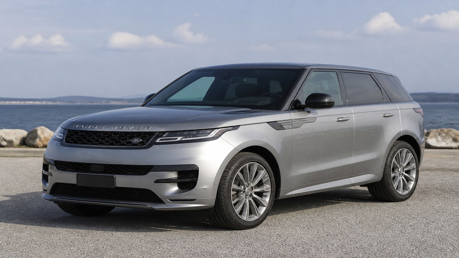 A Range Rover Sport parked outdoors, three-quarter front view.