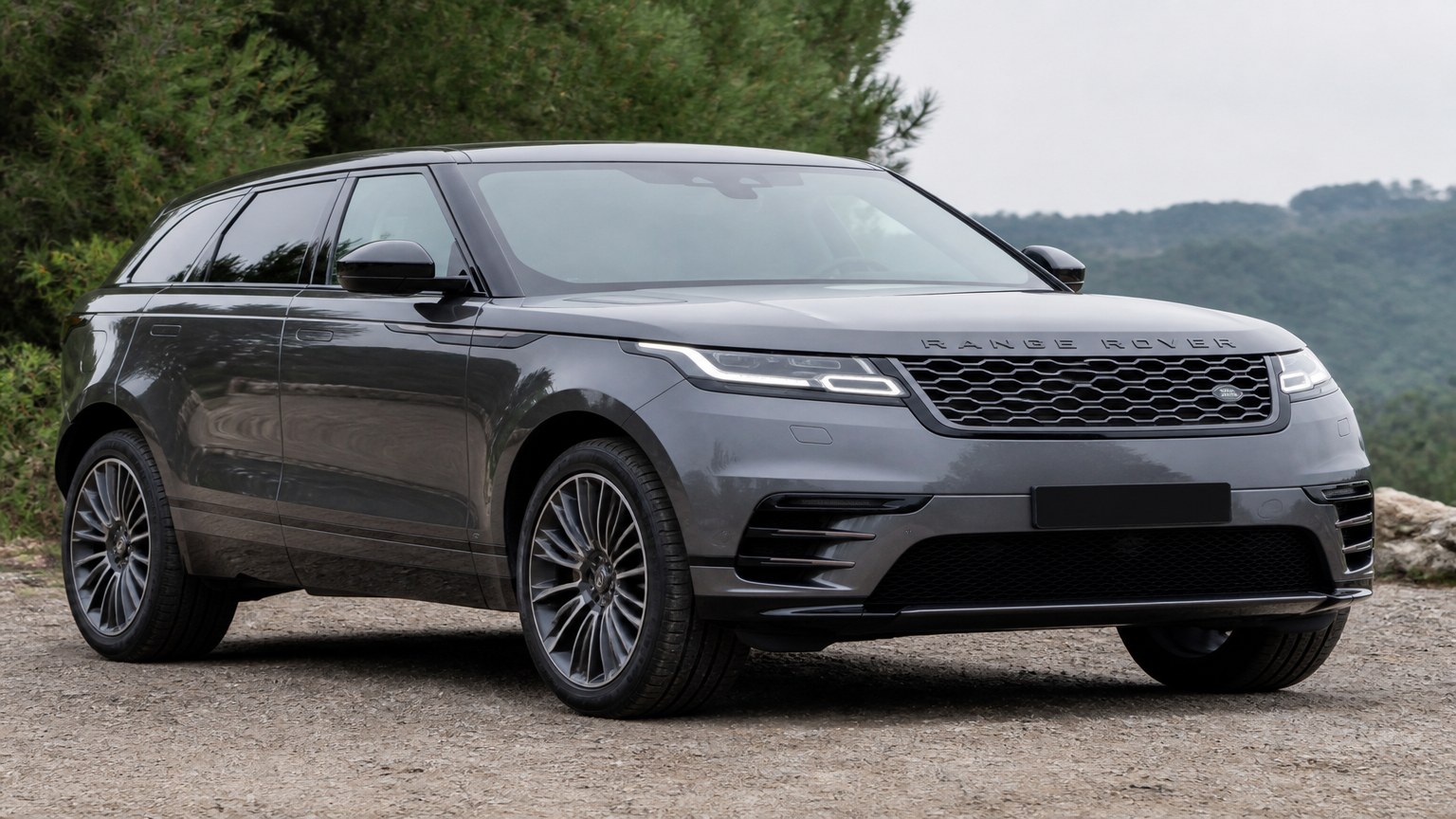 A cleaner later-model Range Rover Velar on a quiet road.