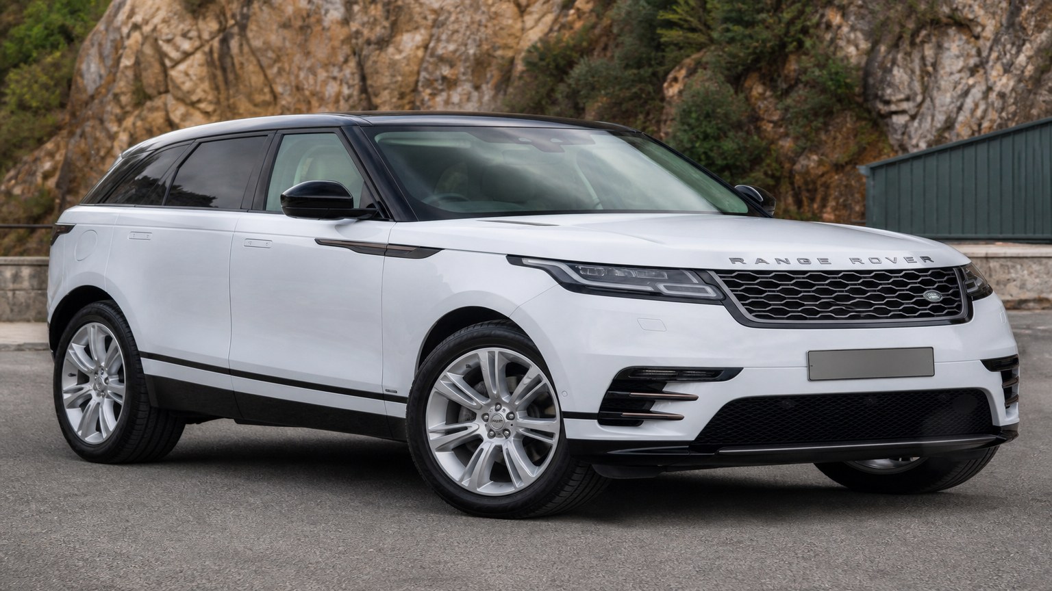 A higher-risk Range Rover Velar model year parked in a dealership lot.
