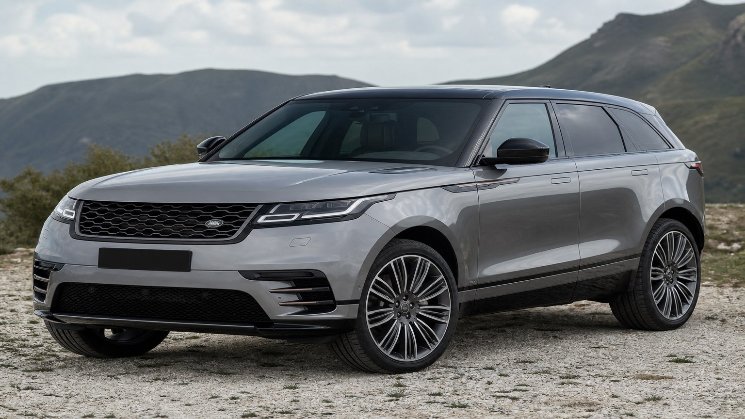 A Range Rover Velar parked outdoors, three-quarter front view.