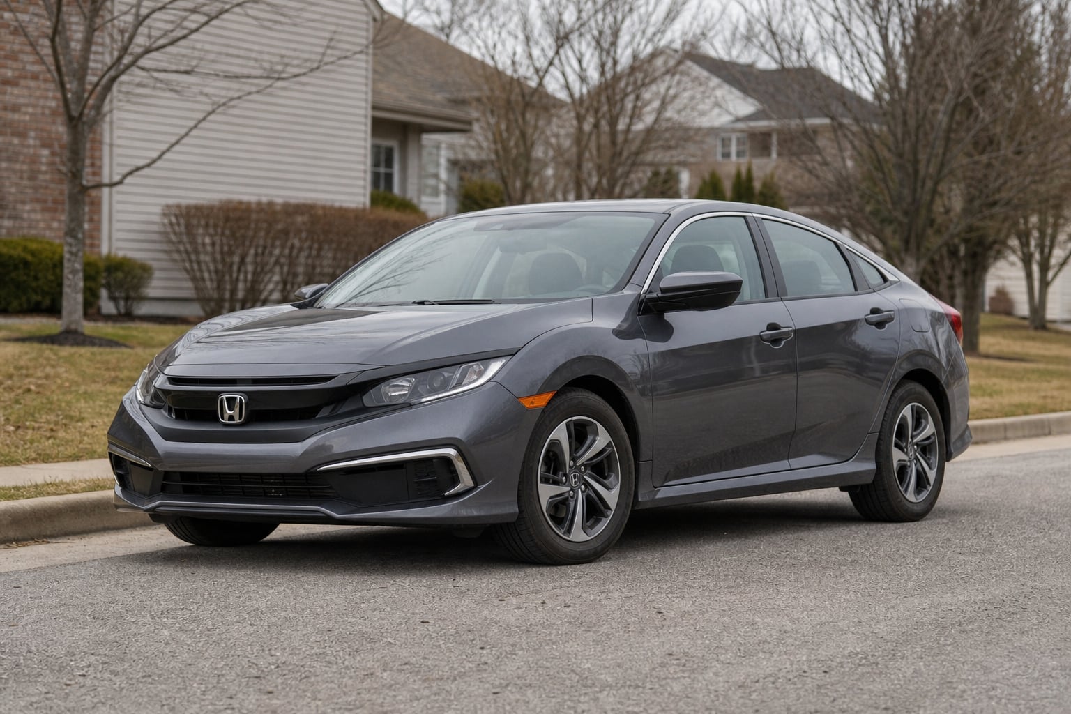 Gray Honda Civic sedan parked on a suburban street