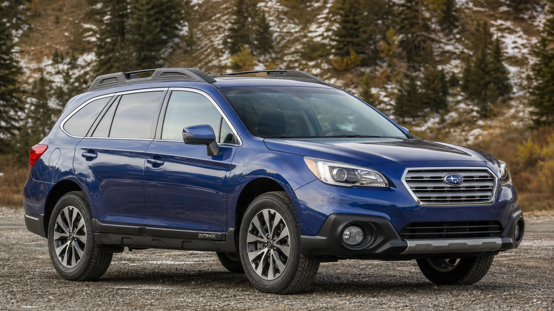 A blue Subaru Outback wagon parked outdoors.