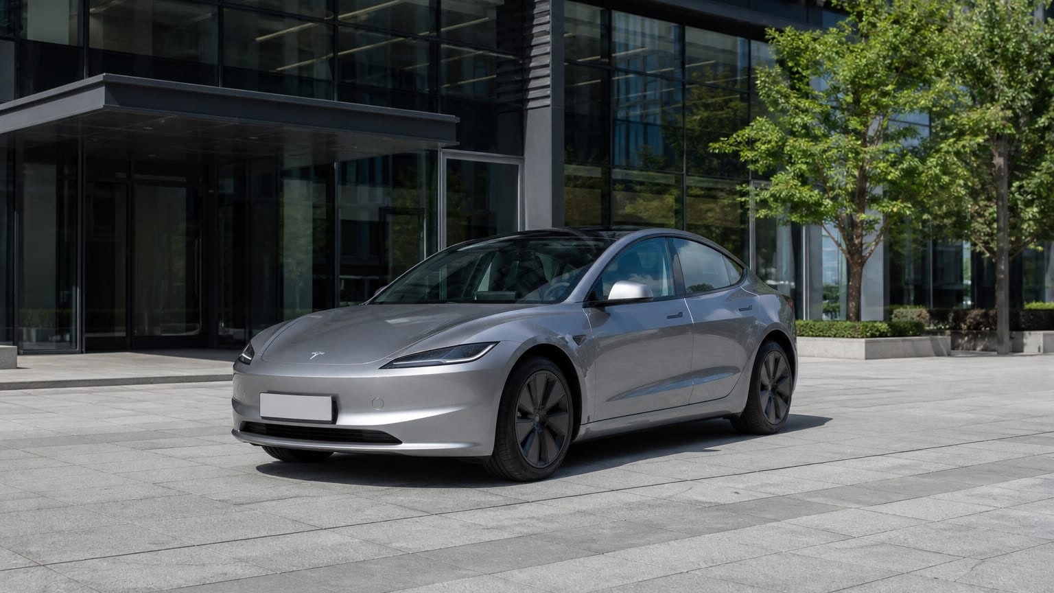 A Tesla Model 3 parked outdoors, three-quarter front view.