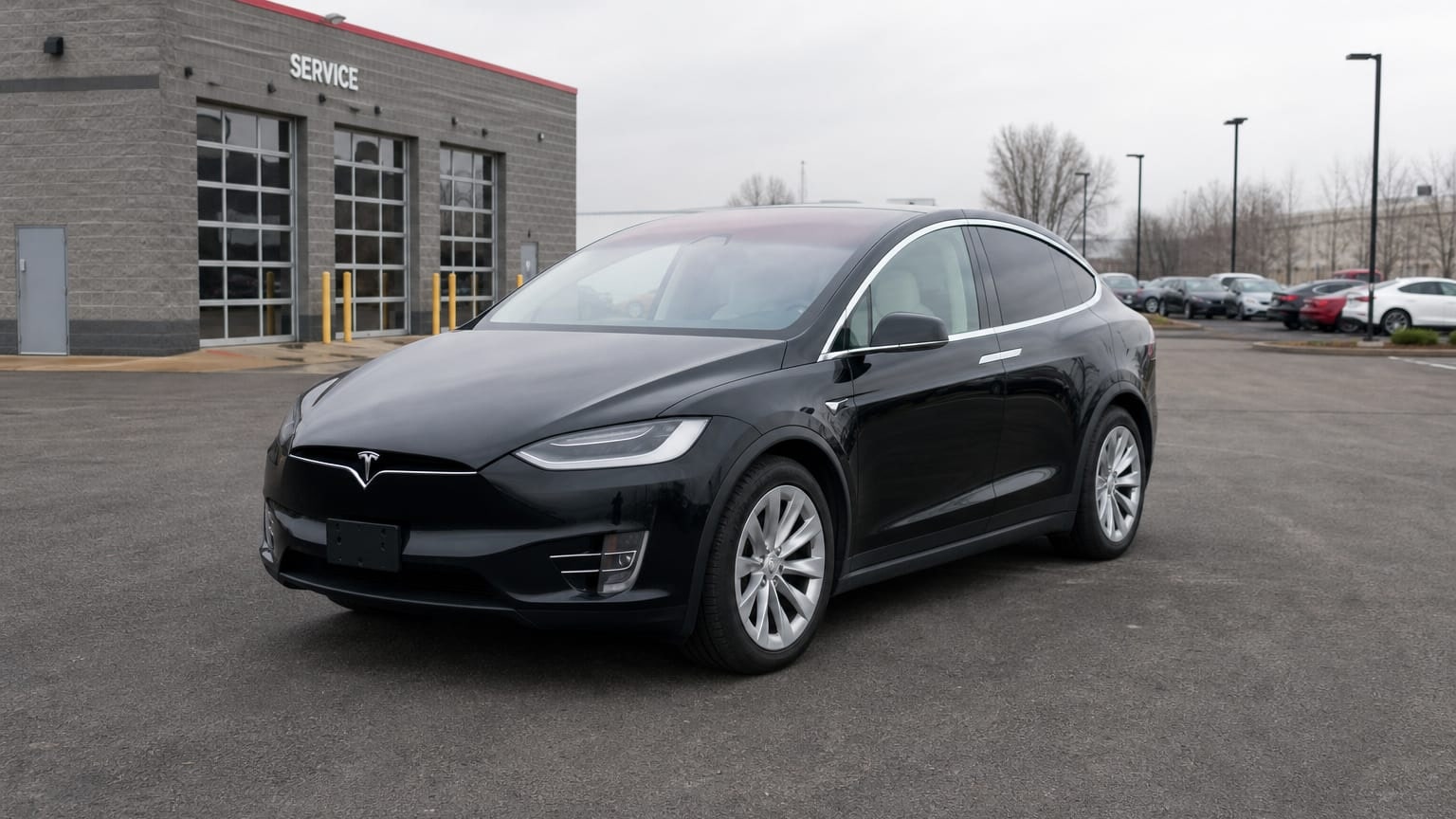A higher-risk Tesla Model X model year parked in a dealership lot.