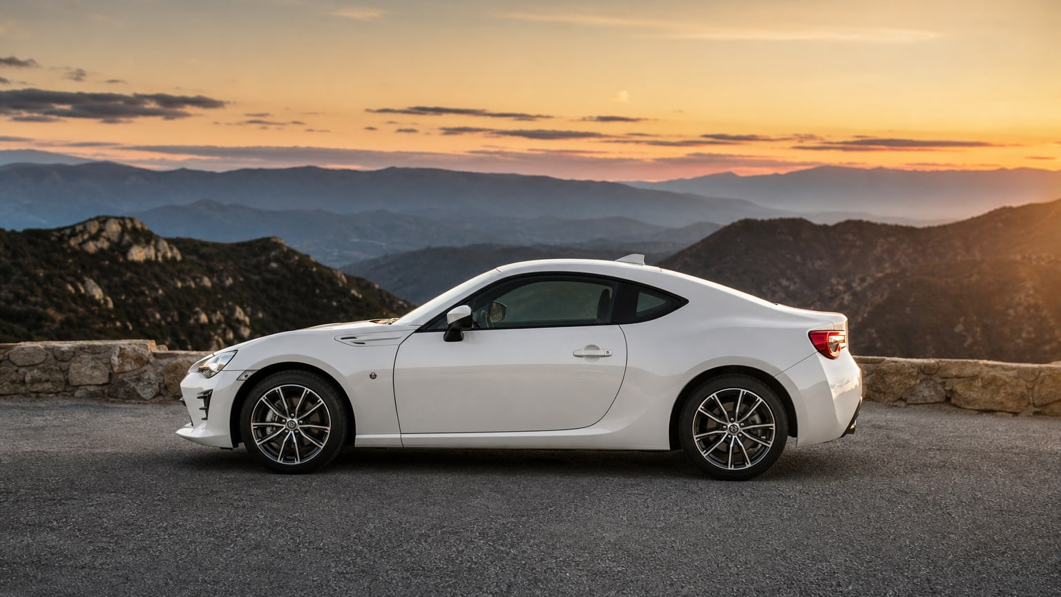 A cleaner later-model Toyota 86 on a quiet road.