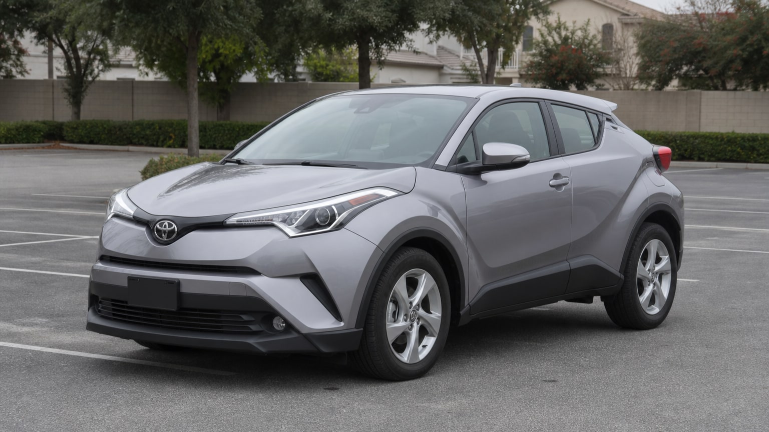 A Toyota C-HR parked outdoors, three-quarter front view.