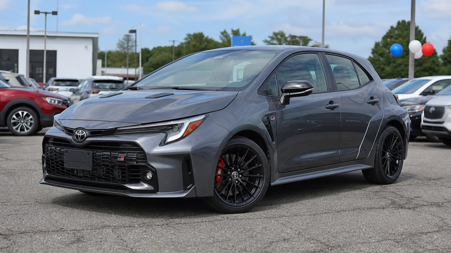 A higher-risk Toyota GR Corolla model year parked in a dealership lot.