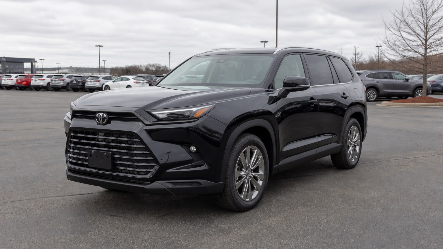 A higher-risk Toyota Grand Highlander model year parked in a dealership lot.