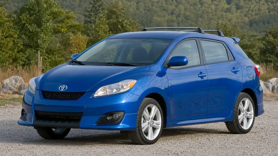 A blue Toyota Matrix hatchback parked outdoors.