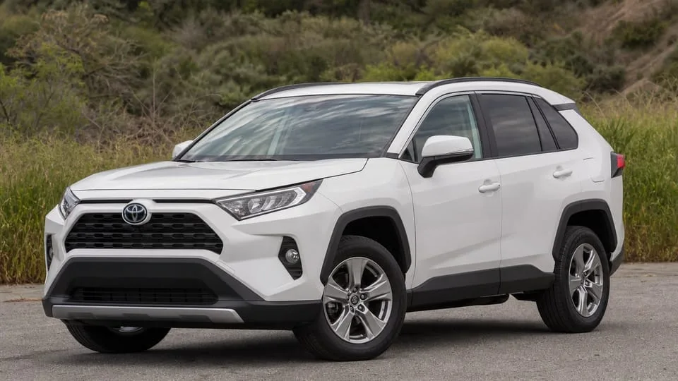 A white Toyota RAV4 crossover parked outdoors.