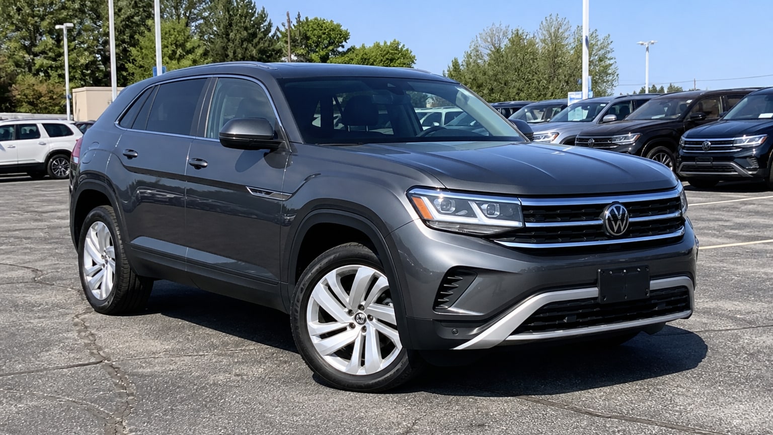 A higher-risk Volkswagen Atlas Cross Sport model year parked in a dealership lot.