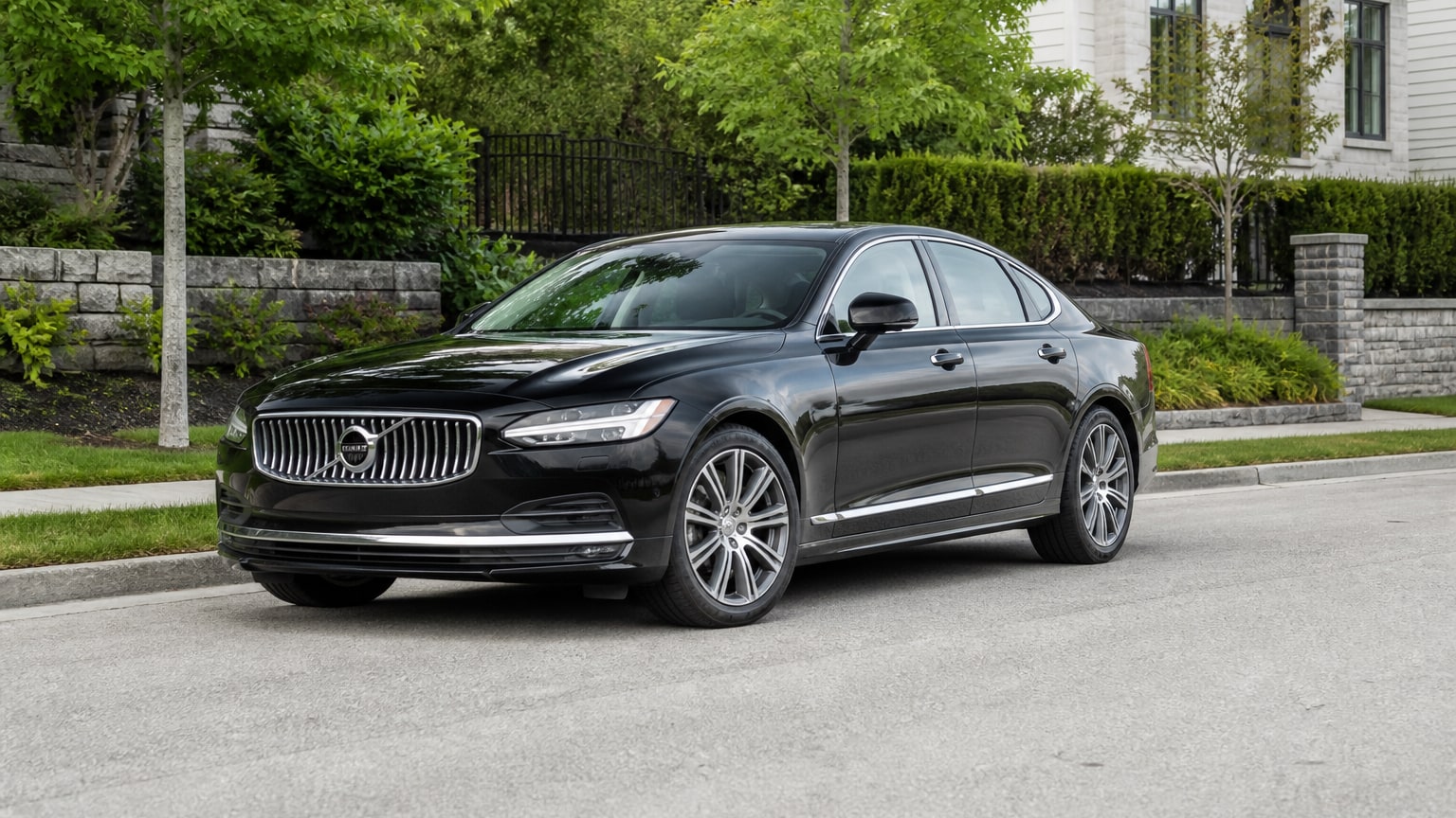 A Volvo S90 parked outdoors, three-quarter front view.
