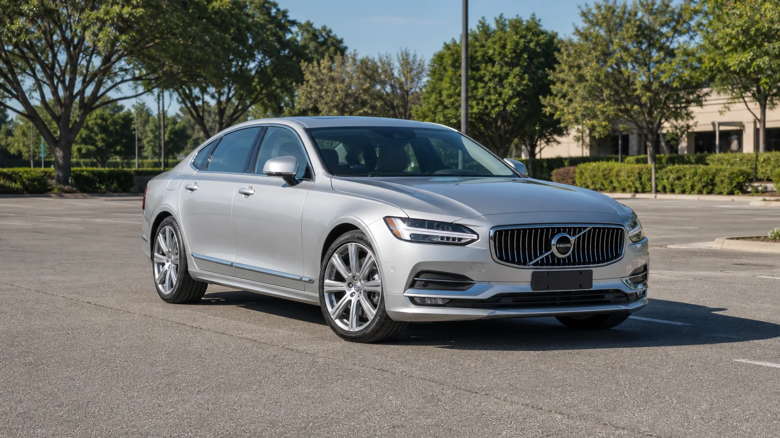 A Volvo S90, three-quarter front view, parked outdoors.