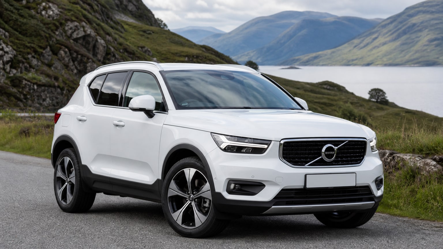 A cleaner later-model Volvo XC40 on a quiet road.