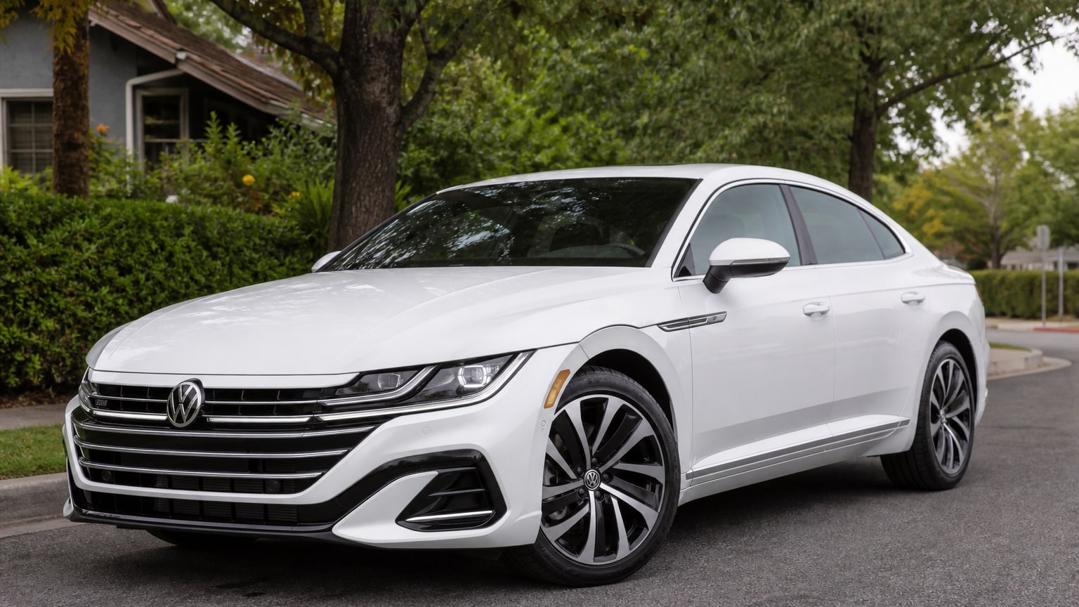 A late-model 2022–2023 Volkswagen Arteon on a quiet residential street.
