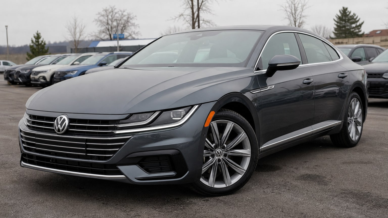 A dark gray 2019–2021 Volkswagen Arteon parked in a dealership lot.